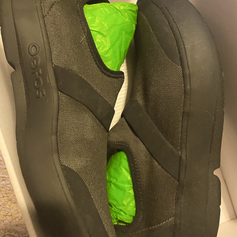 Size 9 W OOFOS. Mesh with green shimmer.